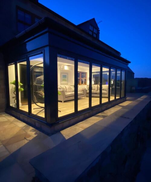 Orangery with Grey Frames and Bi-Fold Doors